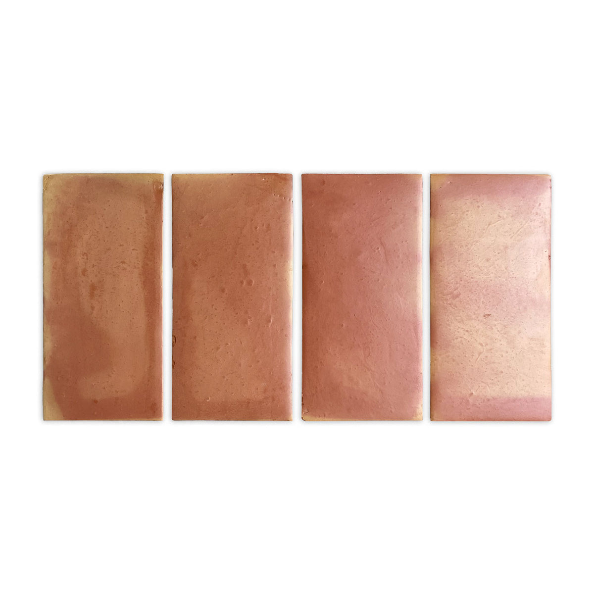 Four smooth satin terracotta tiles by Clay Imports, showing a reddish-brown to pinkish-beige color gradient.
