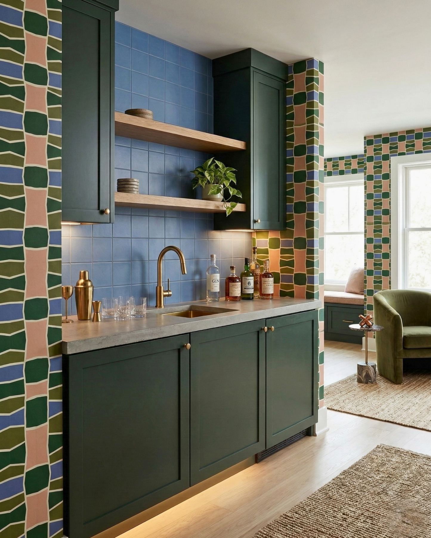 Blue 6x6 clay tiles by Clay Imports, used as a kitchen backsplash with dark green cabinets and wooden shelves.