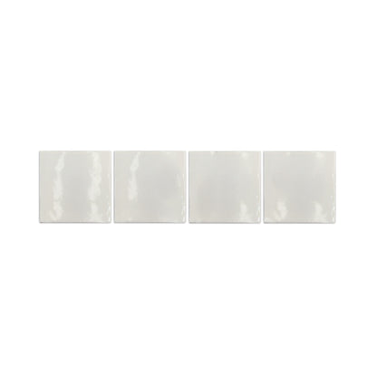 Champagne 6x6 glazed cotto pool waterline tiles by Clay Imports, arranged in a row with a glossy, subtly irregular surface.