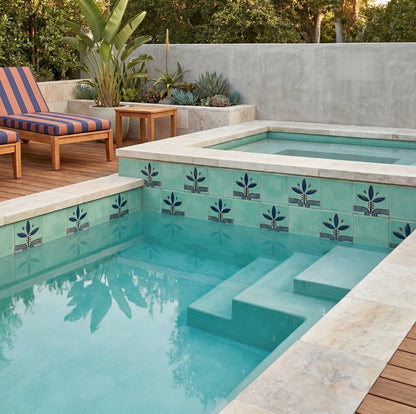Jade 6x6 Glazed Cotto Pool Waterline Tile by Clay Imports, featuring blue floral patterns in a pool and spa setting.