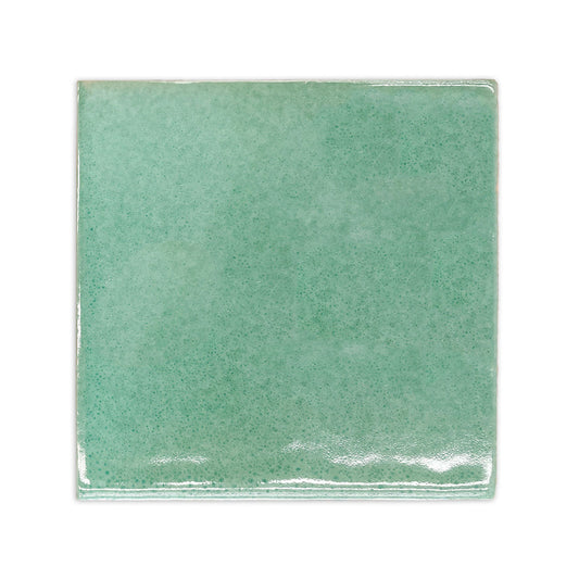 Jade green glazed cotto sample tile by Clay Imports with an irregular surface and glossy finish.