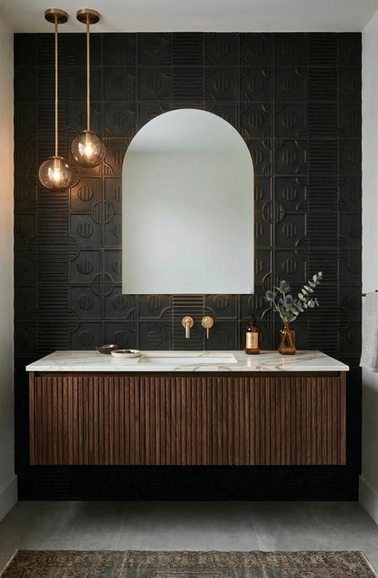 Black Suede 6x6 tiles by Clay Imports featuring mixed geometric patterns on an accent wall behind a vanity.