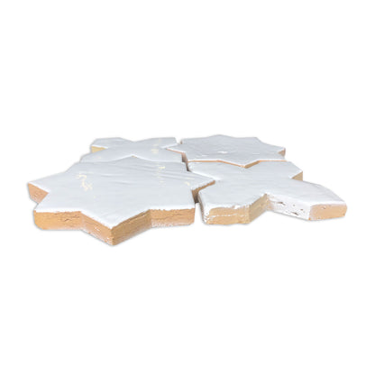 White gloss Glazed Terracotta Star and Cross tiles by Clay Imports, showing natural terracotta edges in a grouped view.