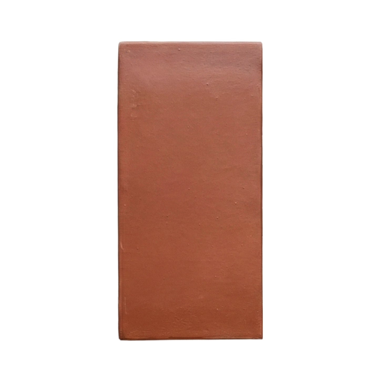 D'Hanis Red 6x12 terracotta sample by Clay Imports, a rectangular tile with a smooth, matte finish and subtle imperfections.