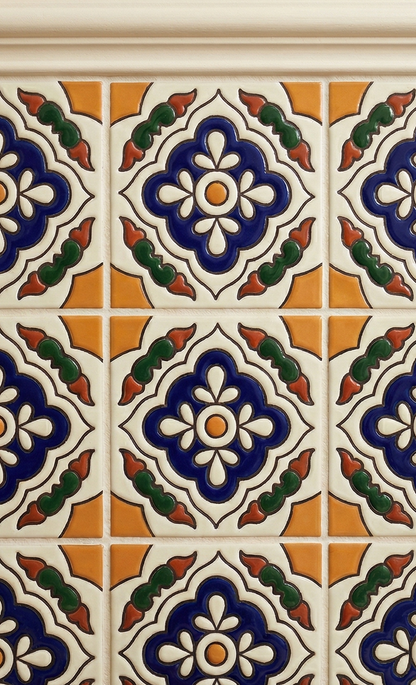 Relief Petunia 6x6 Talavera tile by Clay Imports with intricate blue, white, orange, and green floral relief patterns.