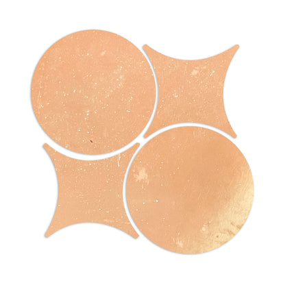 Light orange smooth matte terracotta tiles in rombo and circle shapes by Clay Imports, arranged in an interlocking pattern with subtle speckles.