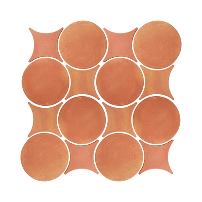 A pattern of terracotta round and star-shaped ceramic floor tiles displays a warm, earthy tone.