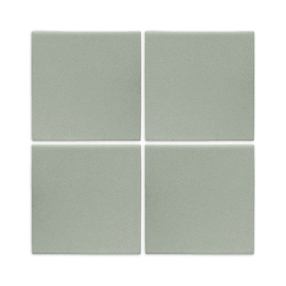 Four agave green square clay tiles by Clay Imports with a matte finish and narrow white grout lines.