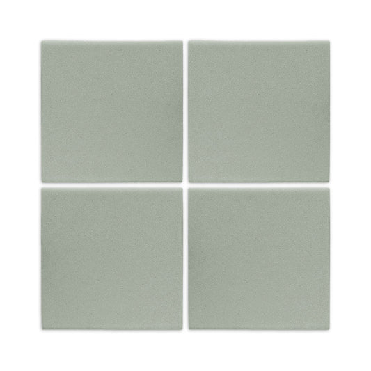 Four agave green square clay tiles by Clay Imports with a matte finish and narrow white grout lines.