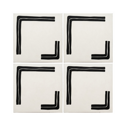Four off-white pattern tiles by Clay Imports, each featuring a bold pitch black geometric 'L' corner design.