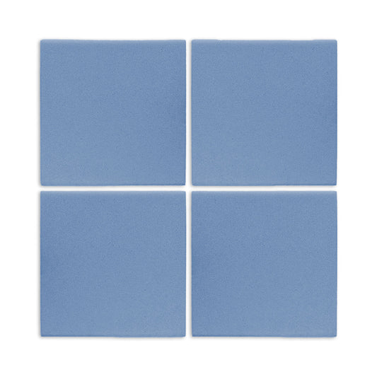 Four denim blue square clay tiles by Clay Imports, arranged in a grid with a matte, textured surface.