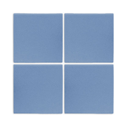 Four denim blue square clay tiles by Clay Imports, arranged in a grid with a matte, textured surface.