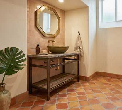 Fleur-shaped smooth gloss terracotta tiles by Clay Imports in warm earthy tones, arranged on a bathroom floor.