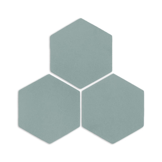 Three hexagon clay tiles in sage green by Clay Imports, arranged in a cluster with visible texture and subtle shadows.
