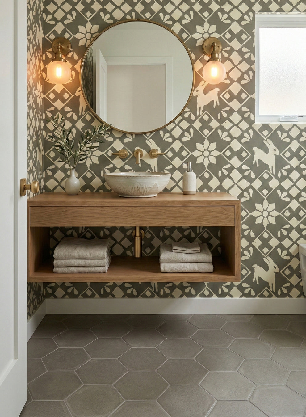 Grey-green hexagon clay tile by Clay Imports, laid on a bathroom floor next to a floating wooden vanity.