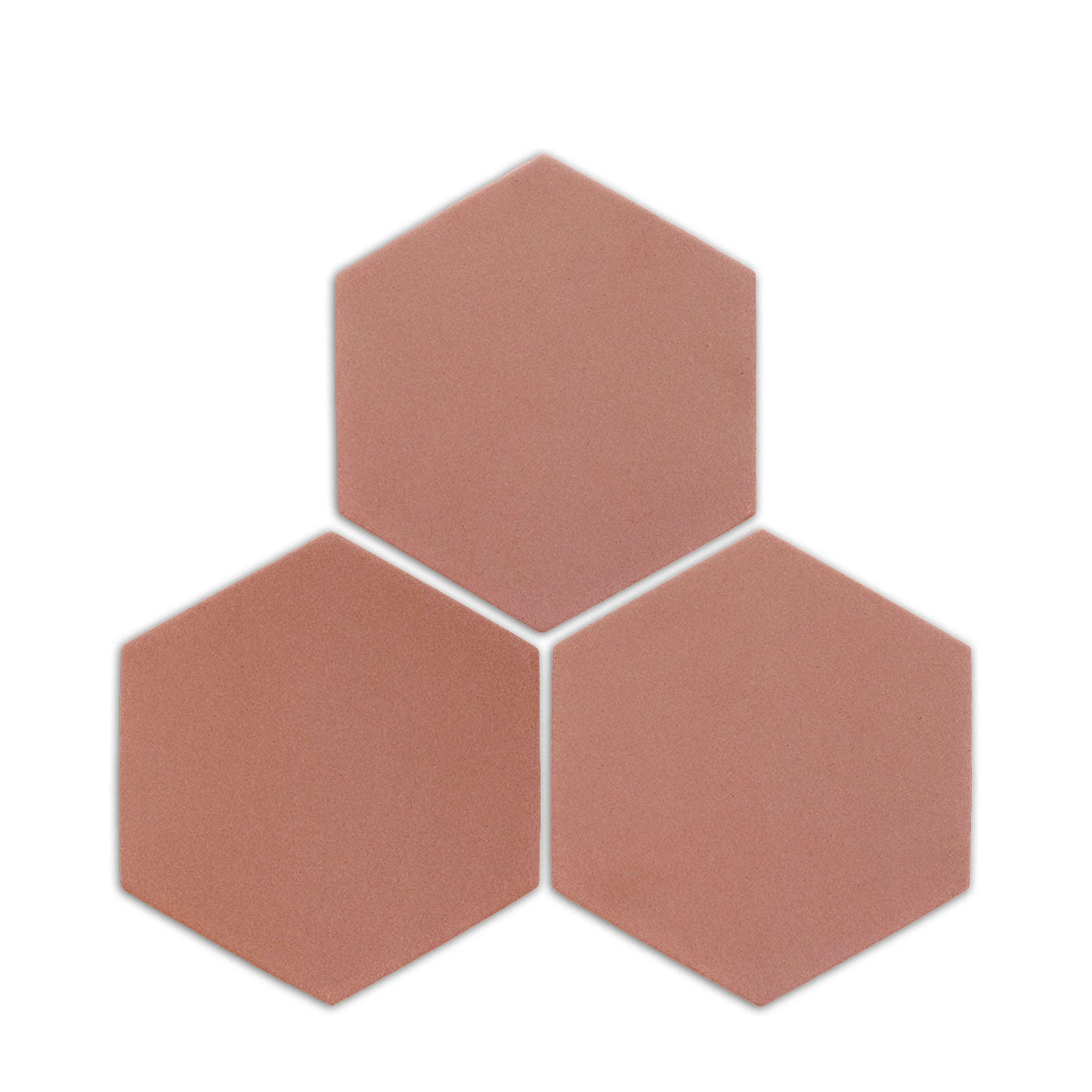 Pink granite hexagon clay tile by Clay Imports, three pieces showing a speckled, matte texture on a white background.