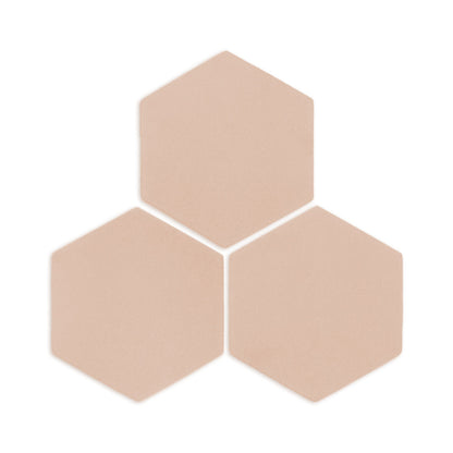 Hexagon Sand Rattler clay tile by Clay Imports, three light beige tiles with subtle texture arranged in a cluster, casting shadows.