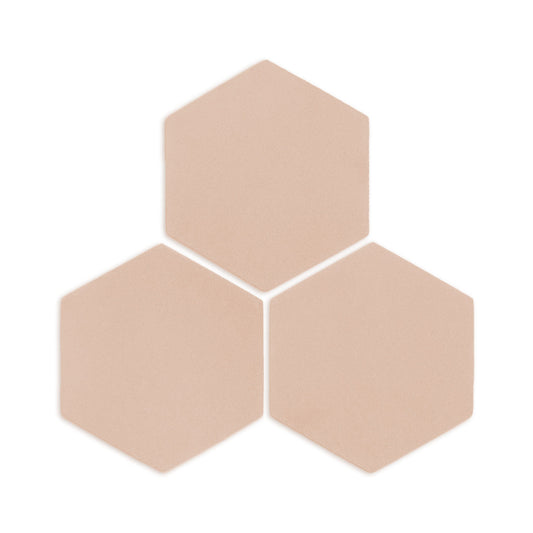 Hexagon Sand Rattler clay tile by Clay Imports, three light beige tiles with subtle texture arranged in a cluster, casting shadows.