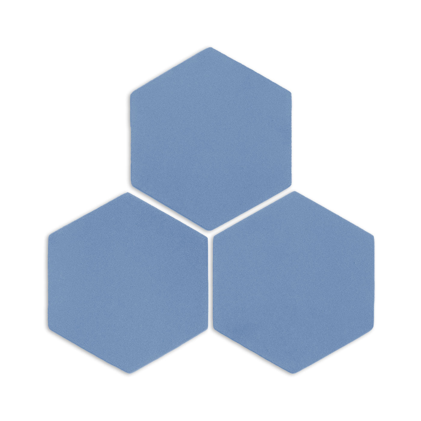 Three denim blue hexagonal clay tiles by Clay Imports, with a subtle matte texture on a white background.