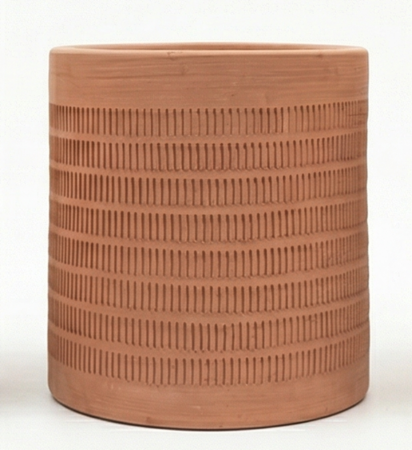 Oaxaca Etched Terracotta Planter by Clay Imports, cylindrical with repeating etched vertical lines in horizontal bands.