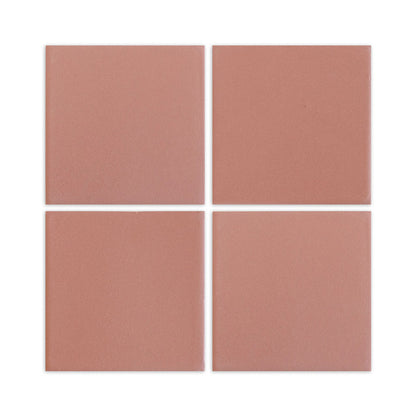 Four square pink granite-effect clay tiles by Clay Imports, with narrow white grout lines.