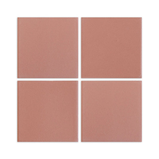Four square pink granite-effect clay tiles by Clay Imports, with narrow white grout lines.