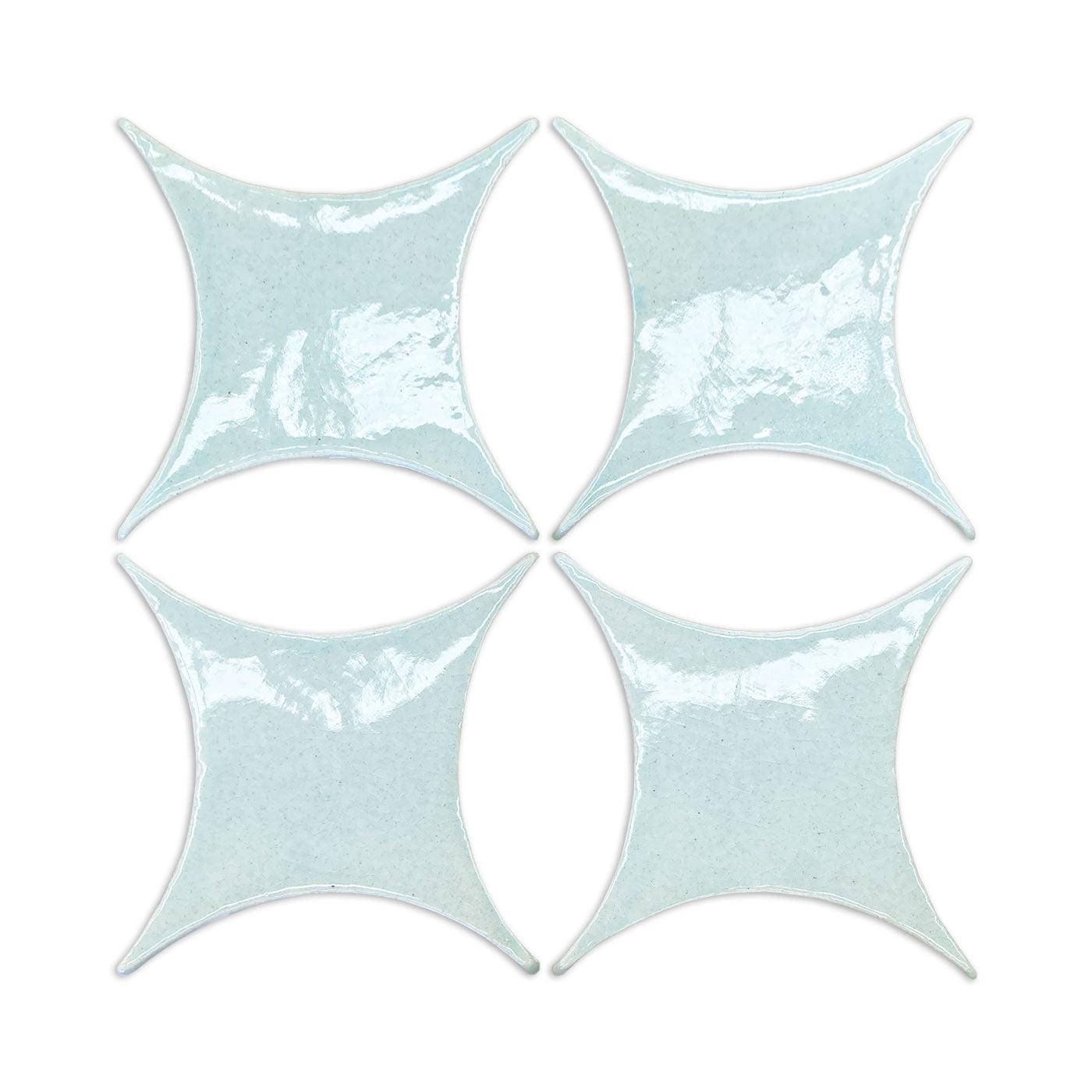 Light blue crackle-glazed ceramic tiles in star shape, set of four, by Rombo & Circle, glossy textured surface, top-down view