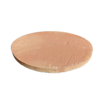 Round reddish-brown terracotta tile with a matte finish by Clay Imports, featuring a rustic, irregular edge.