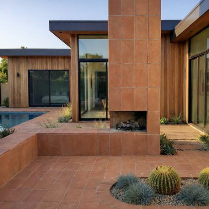 Terracotta Baked Thin Paver 8x16 by Clay Imports, used for an outdoor patio, raised wall, and fireplace cladding.