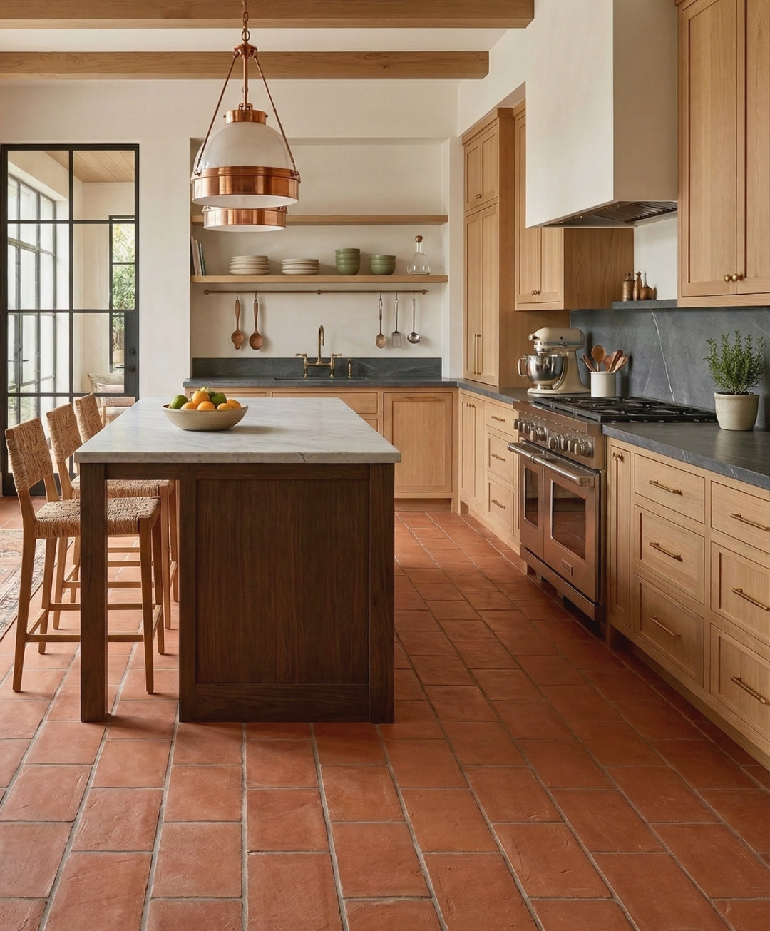 Reddish-brown terracotta Baked Thin Paver 8x16 by Clay Imports, laid on a kitchen floor with visible grout lines.