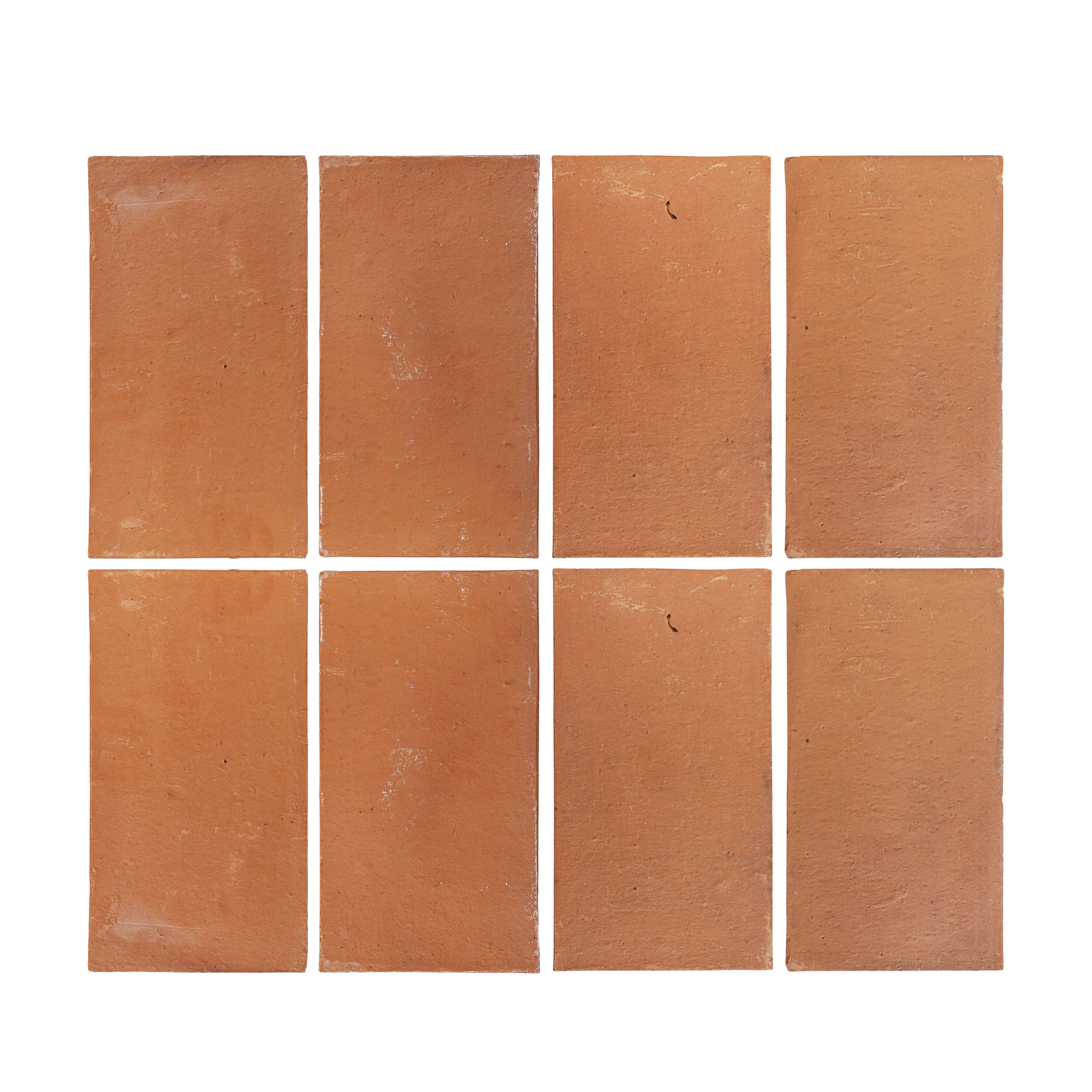 Natural reddish-brown Baked Thin Terracotta Paver 8x16 by Clay Imports, arranged in a grid of eight on a white background with slight imperfections.