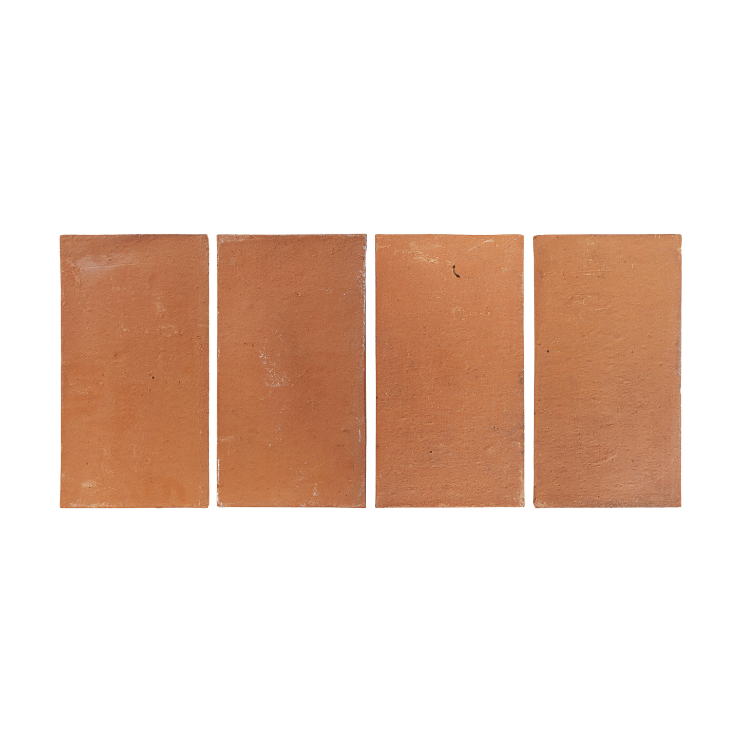 Four terracotta rectangular Baked Thin Pavers by Clay Imports, with textured surfaces and subtle imperfections.