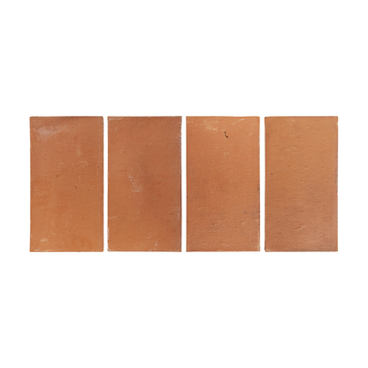 Four terracotta rectangular Baked Thin Pavers by Clay Imports, with textured surfaces and subtle imperfections.