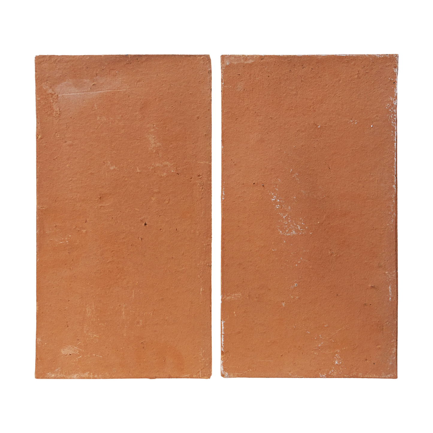 Two reddish-brown terracotta Baked Thin Pavers by Clay Imports, with a rustic, unglazed texture, placed side-by-side.