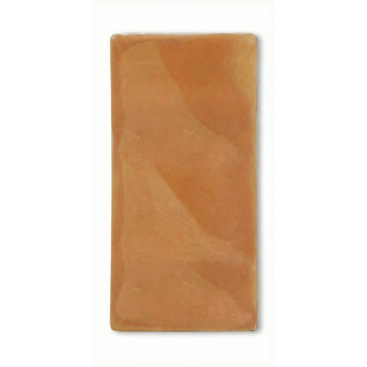 Terracotta tile sample with rounded corners by Clay Imports, featuring a smooth yet naturally varied surface.