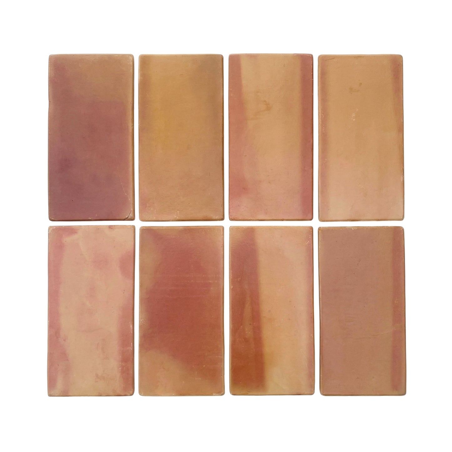 Rounded terracotta tiles by Clay Imports in varied reddish-brown and beige tones, arranged in a grid.