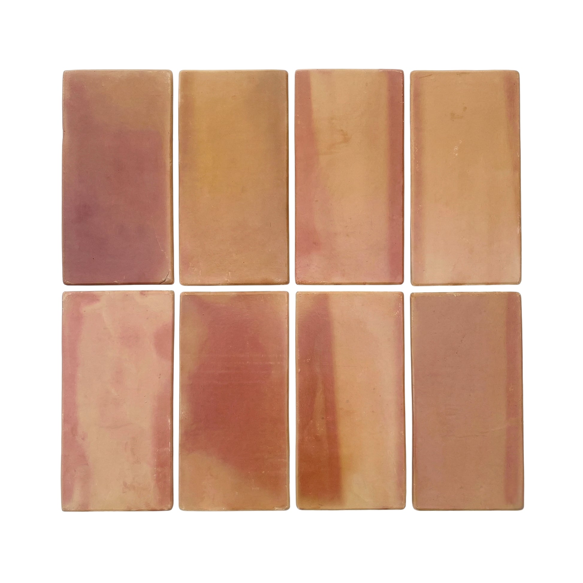 Rounded terracotta tiles by Clay Imports in varied reddish-brown and beige tones, arranged in a grid.