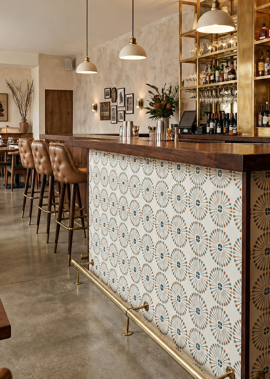 Atomic Vocho Papaya Pattern Tile by Clay Imports, featuring radial designs in teal and orange on a cream background, adorning a bar counter.