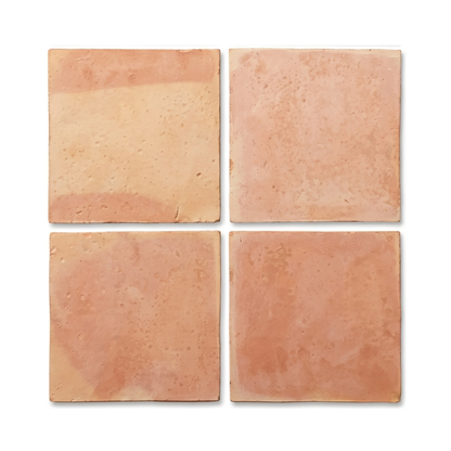 Four smooth matte terracotta tiles by Clay Imports, displaying natural reddish hues and rough edges.