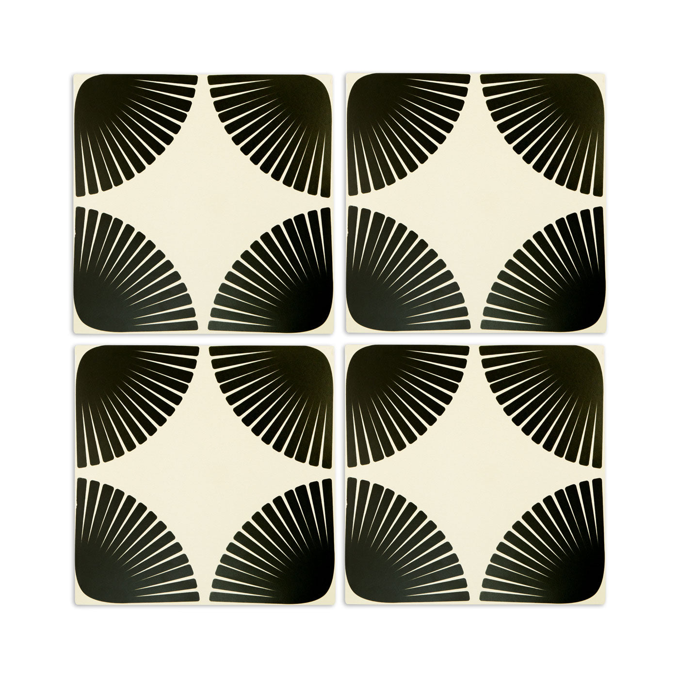 Pattern tile by Clay Imports with rounded black fan-like shapes on an off-white background, forming a star when four are combined.