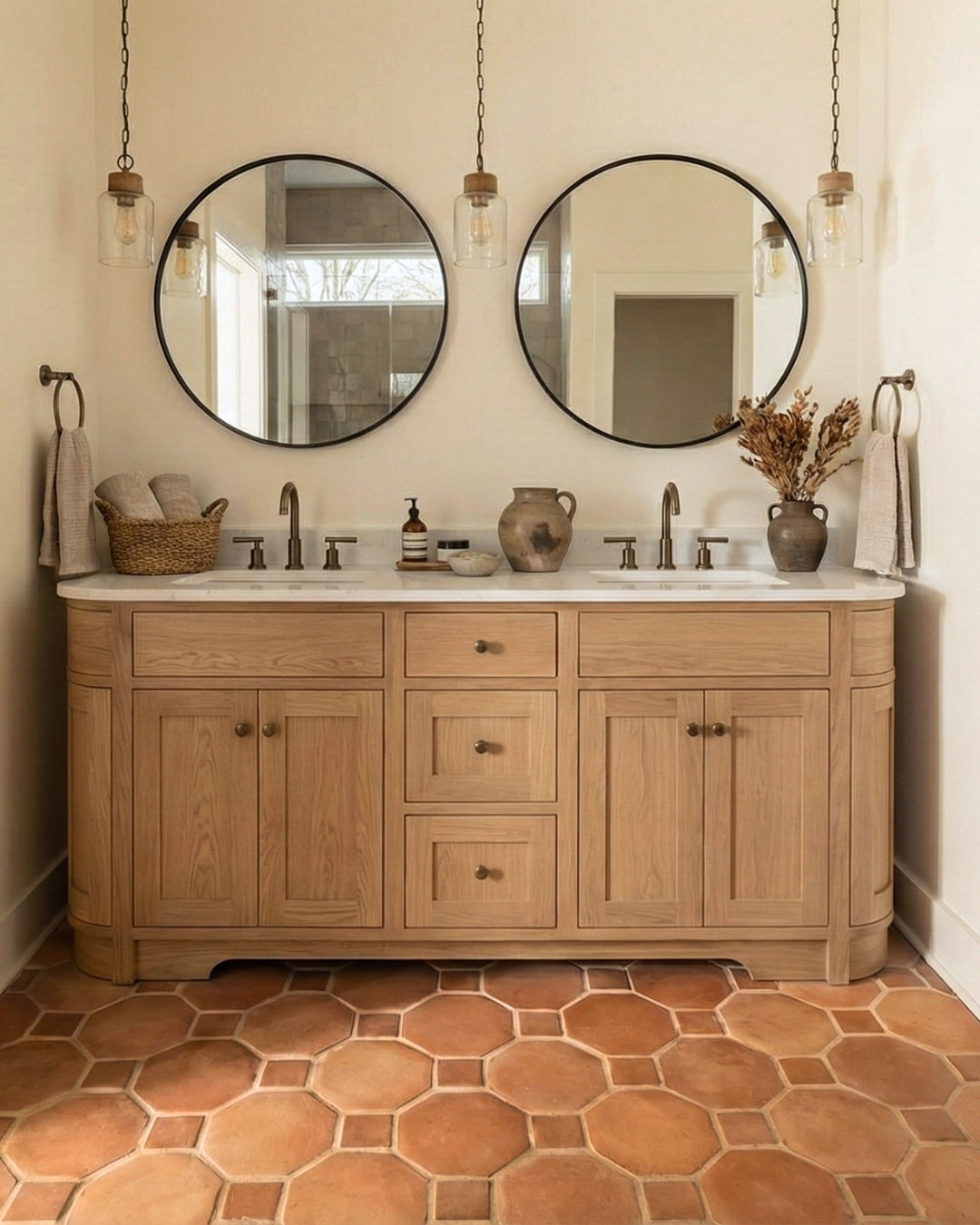 Earthy reddish-brown Terracotta Octagon + Square Smooth Satin 8 tiles by Clay Imports, forming a geometric pattern on a bathroom floor.