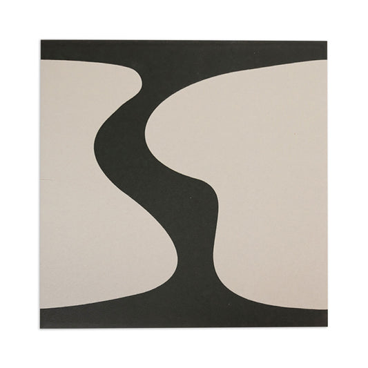 Square tile sample by Clay Imports featuring an abstract black blot design on light beige.