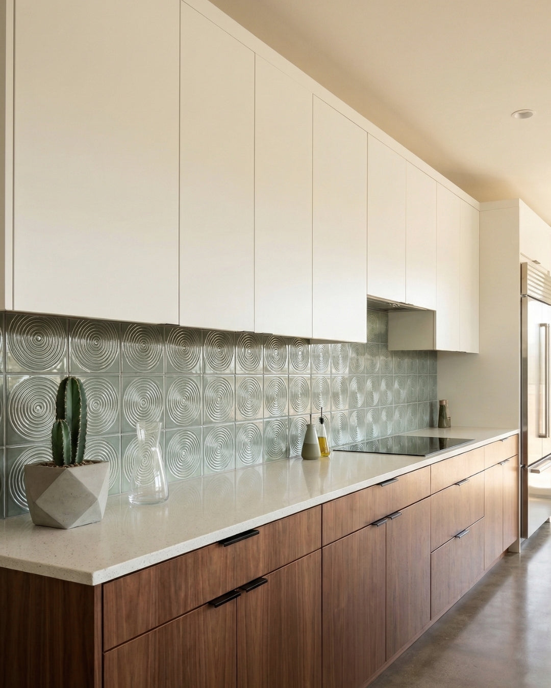 Aurora Arctic Gloss backsplash tiles by Clay Imports, with a concentric circle pattern in a bright modern kitchen.
