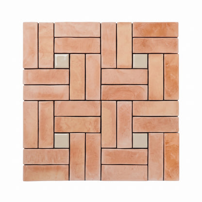 A square mosaic tile sample featuring a brick-pattern arrangement of warm peach and terracotta tiles with a few small light beige accent tiles, shown on a plain white background.