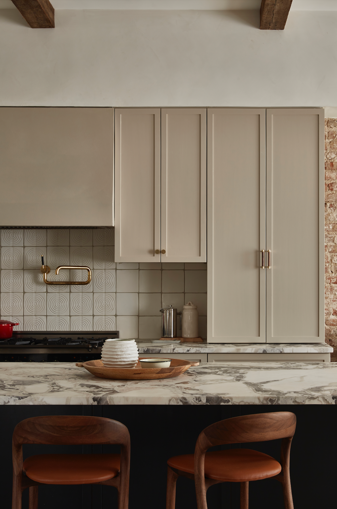 The image shows a kitchen setting with the Dusk White Gloss 6x6 tiles installed on the wall behind the counter. The tiles have a relief texture and a glossy finish.