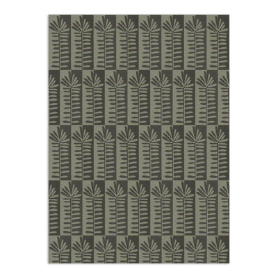 Muted green botanical wallpaper by Clay Imports, featuring vertical columns of stylized fronds on an offset checkerboard background.