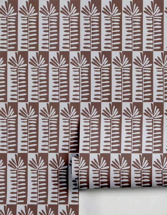 Brown and light gray Florería wallpaper by Clay Imports, showcasing a repeating pattern of stylized plants on vertical stripes with checkerboard squares, partially unrolled.