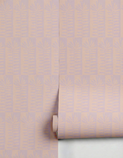 Lilac and peach striped wallpaper by Clay Imports with alternating botanical fern and fan patterns, partially unrolled.