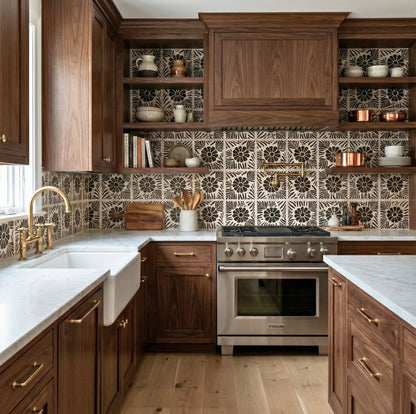 Black Freno Vocho patterned tiles by Clay Imports with a floral design installed as a kitchen backsplash.