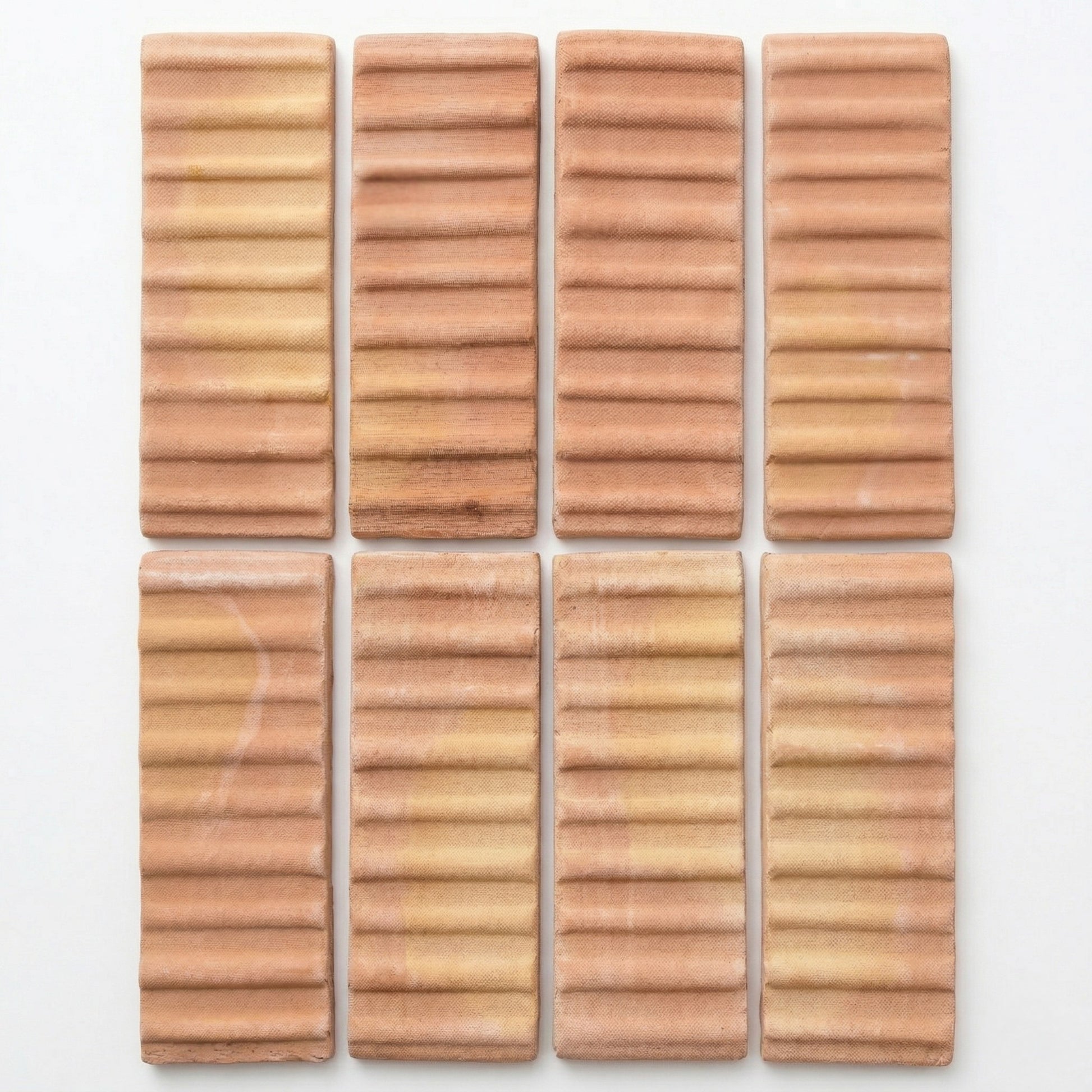 Bundle of 3D Hatch Terracotta Matte Sealed tiles by Clay Imports, with horizontal ribbed texture and varying terracotta shades, displayed in a grid.